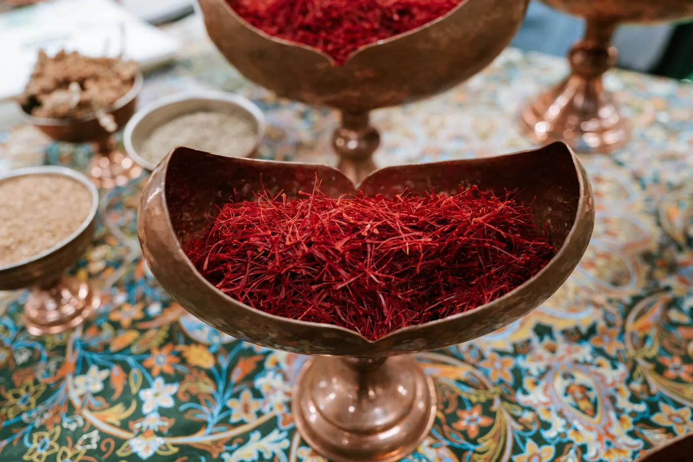 Detail shot of saffron in brass bowls at a booth at BIOFACH in Nuremberg