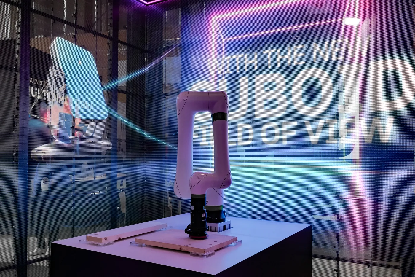 Robot exhibit in front of an LED wall with light effects, technology fair Nuremberg