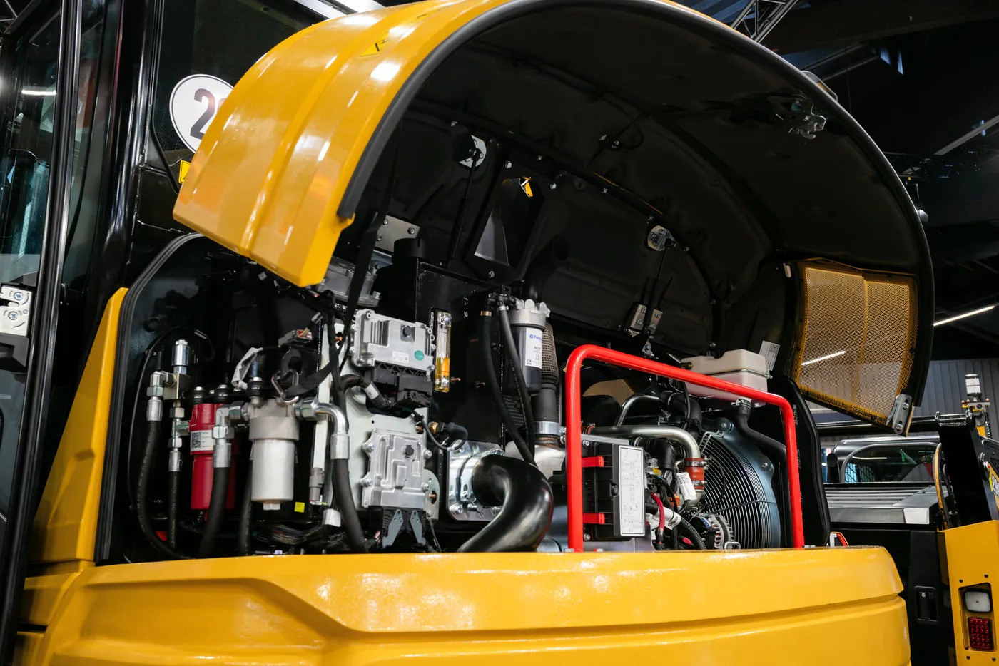 Technical close-up of the opened engine bay of a construction machine at GaLaBau in Nuremberg