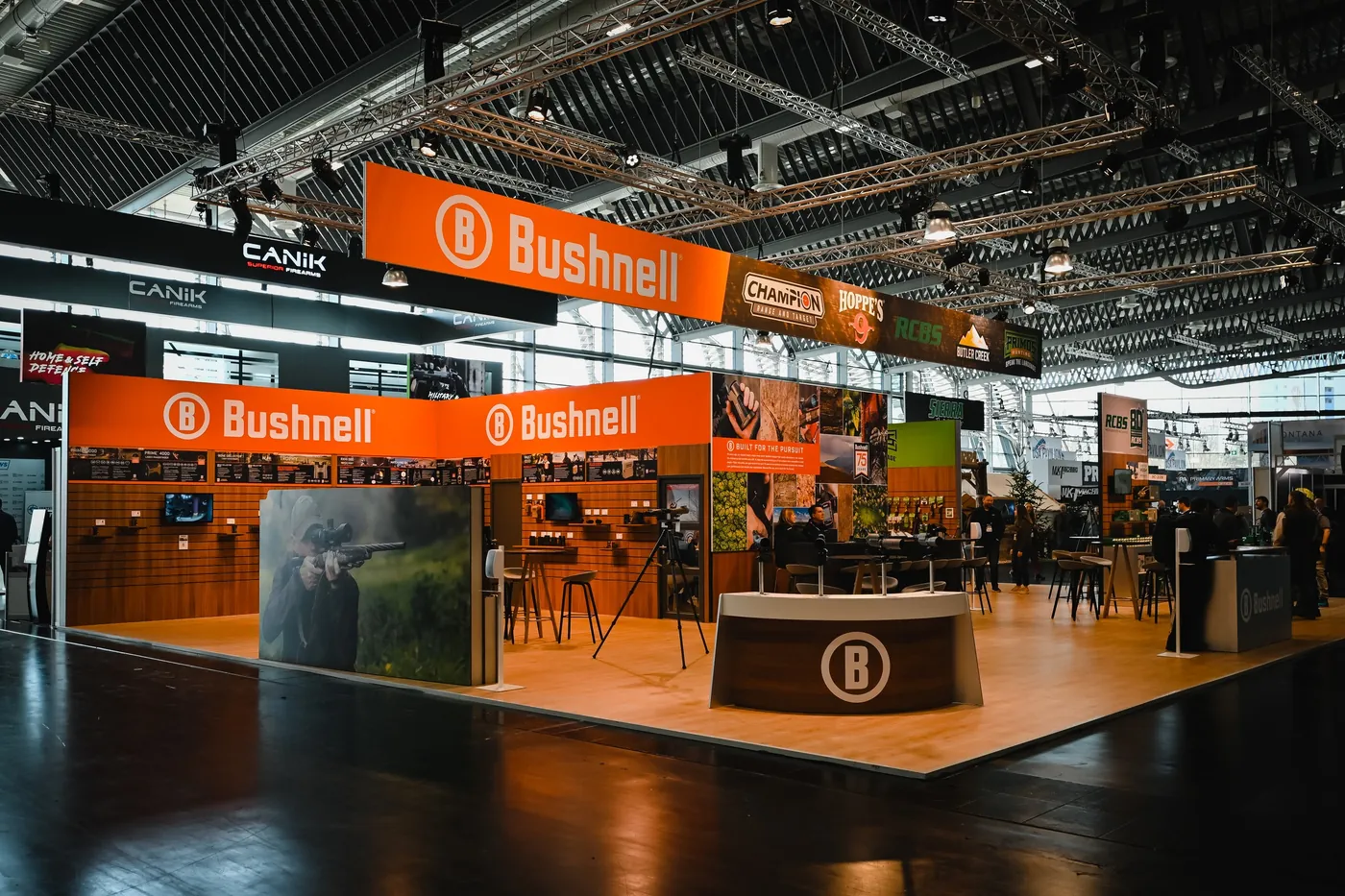 Large orange brand booth at IWA OutdoorClassics in Nuremberg