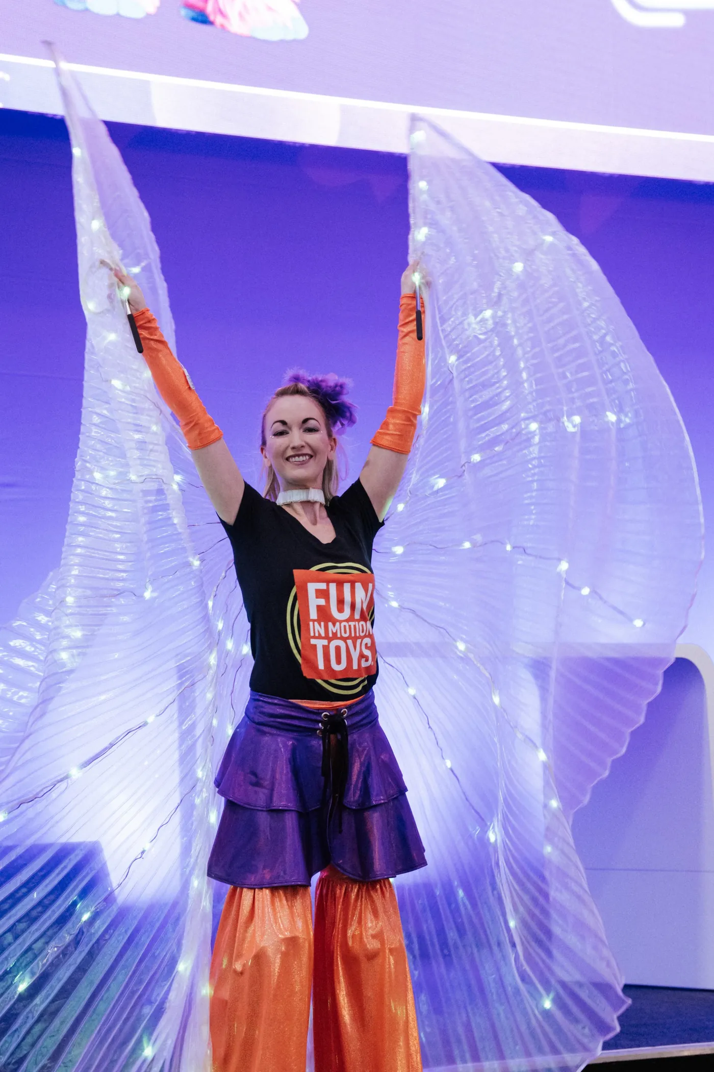 Dancer with light wings on stage