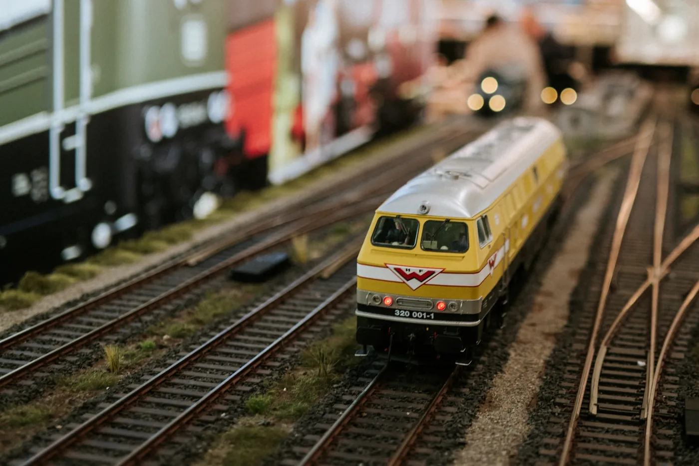 Detail shot of a model railway locomotive on a layout at a booth at Spielwarenmesse in Nuremberg